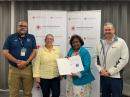 On hand for the signing of the new MOU (left to right): Emmanuel J. Cruz, NP4D, Secretary, ARRL Puerto Rico Section; Nory Bonilla, Logistic Specialist, American Red Cross of Puerto Rico; Carmen N. Greene, KP4QVQ, ARRL Puerto Section Manager; Joseph Guzman, Regional Disaster Officer, American Red Cross of Puerto Rico [Photo courtesy of ARRL Puerto Rico Section]